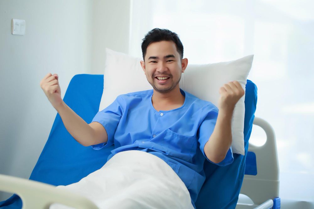 An invigorated patient in hospital dress